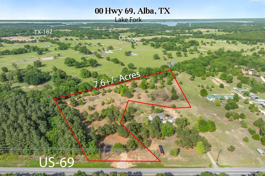 Positioned just minutes from Lake Fork, one of the most renowned bass fishing lakes in Texas, this 7.6± acre tract offers a rare combination of location, usability, potential, and no known restrictions. With direct access off US-69, the property provides excellent visibility and convenience while still maintaining a private, tucked-away feel once you step onto the land. The acreage is a beautiful mix of open pasture and scattered mature trees, creating that sought-after park-like setting buyers are after. The land has already been partially cleared, giving you a head start whether your vision is a homesite, weekend retreat, multi-generational compound, homestead, or small acreage investment. A small pond adds character and functionality, with room to expand or enhance for livestock and animals, recreation, or aesthetics. The layout of the property offers multiple ideal build sites, with enough depth and tree coverage to create privacy from the road while still enjoying quick access in and out. Surrounded by well-kept properties and wide-open East Texas countryside, this tract sits in a high-demand area near Alba, just a short drive to Lake Fork for fishing, boating, and year-round recreation. Whether you are looking to build, invest, or hold for future growth, this is the kind of versatile land that continues to be harder to find. No known restrictions and outside city limits, giving you the flexibility to make it your own. Old RV on site given no value. Buyer and buyer’s agent to verify the availability, capacity, and providers of all utilities. Information provided is deemed reliable but not guaranteed. Local area providers include SWEPCO for electric, Peoples Communications for fiber optic internet, and Upper Sabine Valley Solid Waste Management District for water service.