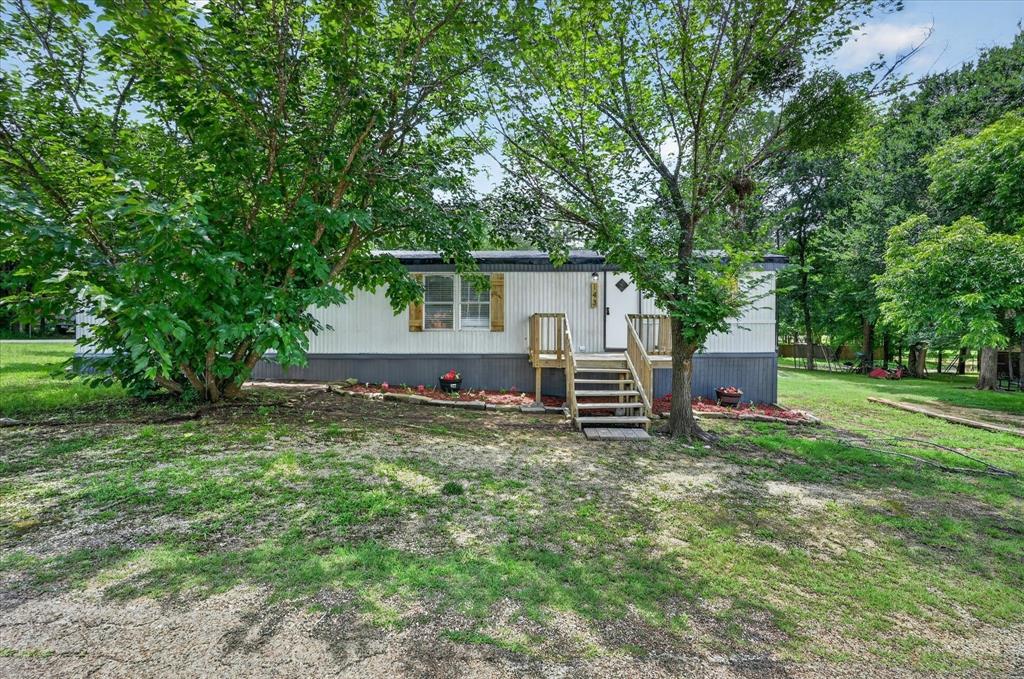 Completely refreshed and move-in ready in the highly desirable Blue Water Oaks subdivision! Situated on 5 lots, this beautifully updated property offers extra space, flexibility, and that peaceful lake-community lifestyle buyers are searching for. This charming 2 bedroom, 2 bathroom home has been thoughtfully renovated with major updates including a NEW roof, NEW AC system, newly leveled foundation, NEW kitchen appliances, fresh interior paint, NEW flooring and carpet throughout, plus updated blinds and modern lighting fixtures that give the home a clean and inviting feel from top to bottom. Whether you're looking for a full-time residence, weekend lake retreat, rental opportunity, or starter home, this property checks all the boxes with its fresh updates and oversized lot setup. Blue Water Oaks is known for its incredible community amenities including boat ramps, community docks, parks, playgrounds, and a clubhouse — making it easy to enjoy the lake lifestyle year-round. Affordable, updated, and packed with potential — this one is ready for its next chapter.