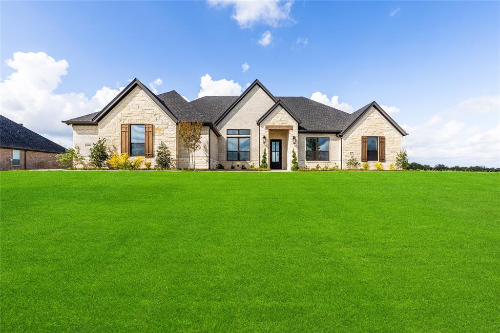 Showcase of Homes 1st place winner! Welcome to your dream home, a brand-new construction masterpiece from the Signature Series by renowned builder Couto Homes. Perfectly situated in the prestigious South Bend Estates, this stunning Hampton model offers nearly 3,000 square feet of thoughtfully designed single-story living that combines luxury, comfort, & sophisticated design. From the moment you step through the 8-foot iron front door, you are greeted by a breathtaking barrel ceiling in the entryway, leading you into an expansive open-concept living area featuring a spectacular coffered ceiling & a floor-to-ceiling stone fireplace with a rustic cedar mantle. Wood like flooring flows seamlessly through the main living areas, study, & game room. The gourmet kitchen is centered around a large island with a contrasting stain finish. Custom-painted cabinetry is raised to the 10-foot ceiling, featuring lighted glass-front uppers for a touch of elegance. This dream kitchen is equipped with stainless steel appliances, including a gas cooktop and a double oven, drawer microwave, and beautiful granite countertops. Thoughtful details like a pull-out spice rack, utensil holder, & soft-close drawers make this kitchen as functional as it is beautiful. Retreat to the luxurious primary suite, which boasts a box ceiling &  a stylish barn door entry to the spa-like ensuite bath. The bathroom is your private oasis, featuring a large walk-in shower with a frameless glass panel, a freestanding pedestal tub, dual vanities with an above-counter cabinet & decorative mirrors & stunning closet. The luxury extends outdoors to the covered porch featuring stained beadboard ceiling & a convenient gas stub for your grill—perfect for relaxing or entertaining. 3-car garage with steel doors and epoxy flooring provides ample space for vehicles & storage. For maximum comfort & efficiency, the home includes a radiant barrier roof decking, foam lid insulation & a 14 SEER Trane HVAC system.