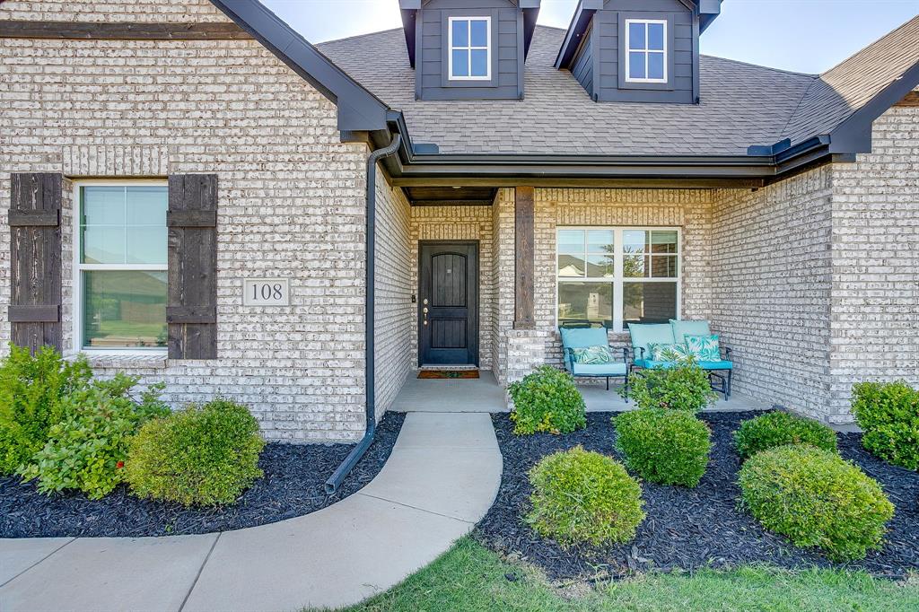 Welcome home to this beautifully crafted custom brick residence with a new roof, replaced in June 2026, perfectly situated on a spacious half acre lot that offers the ideal balance of comfort, functionality, and room to enjoy. From the moment you step inside, the open and inviting floorplan creates a warm atmosphere that is perfect for everyday living and entertaining guests.  The heart of the home is the stunning kitchen featuring granite countertops, a large center island, breakfast bar with stylish pendant lighting, stainless steel appliances, and a bright breakfast nook overlooking the backyard. The adjoining living area is anchored by a beautiful wood burning fireplace, creating the perfect gathering space for family and friends.  Designed with privacy in mind, the split bedroom layout offers a peaceful primary retreat complete with dual vanities, a relaxing garden tub, separate walk in shower, and an oversized closet. A versatile flex room provides endless possibilities and can easily serve as a home office, game room, fitness area, or second living space to fit your lifestyle. Step outside to the open patio where there is plenty of space for outdoor dining, weekend barbecues, or simply unwinding while taking in the peaceful surroundings. With its thoughtful design, generous living spaces, and desirable half acre setting, this home is one you will not want to miss.