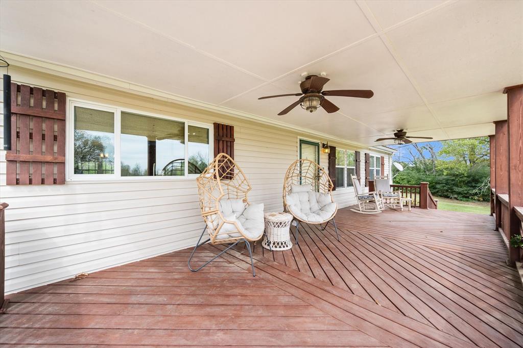 Spacious country living on approximately 8.532 acres in Buffalo ISD! This 3-bedroom, 2-bath home with a dedicated office offers the perfect blend of comfort, functionality, and room to roam. Enjoy peaceful mornings and relaxing evenings on the beautiful, oversized covered front and back porches—ideal for taking in the surrounding views.

Inside, you’ll find a generously sized layout with a private primary suite featuring an ensuite bathroom with double sinks and ample space. The secondary bathroom also includes double sinks and stunning countertops, while gorgeous finishes continue throughout the home. The kitchen is designed for both everyday living and entertaining, complete with an island and a separate dining area.

The office provides a great work-from-home setup or flex space to fit your needs. Outside, the possibilities are endless—this acreage can be anything you envision, whether it’s for recreation, animals, or simply enjoying wide open space.

This property is well-equipped with improvements, including a detached two-car garage, a large workshop-storage area with garage doors and additional covered parking, an oversized and tall covered shed for equipment and parking, and an additional storage building with a covered open area alongside. Storage abounds with multiple areas and ample covered parking for ATVs, equipment, or extra vehicles.

If you’re looking for space, versatility, and peaceful country living, this property checks all the boxes!