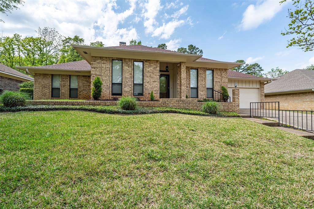 This updated 4 bed 2 full bath 1 half bath home is located on a quiet street in a desirable area within minutes of what Tyler has to offer. Extremely well-maintained this home features a spacious living room with a fireplace and wet bar. The perfect sunroom lets you enjoy all types of weather while taking in the professionally landscaped backyard that includes a peaceful water feature. The layout is hard to find having the extra 1-2 bath and formal dining area which is great for hosting or for a larger family. Recent updates include new flooring, removal of popcorn ceilings, canned lights, ceiling fans, gutter guards and more. This home is more than move-in ready!