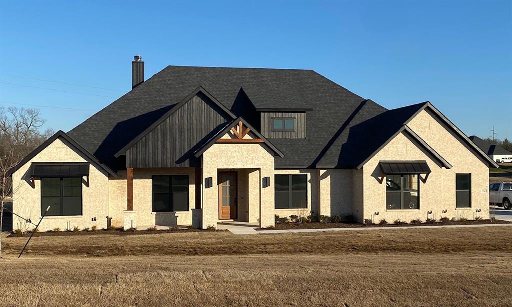 The last home left in the sought after Mockingbird Springs! This beautiful home being built by AGC Custom Homes will feature 4 oversized bedrooms, 3 baths, an office and game room. Hardwood floors throughout the entry, office, living, kitchen, dining area, Gameroom and hallways! Oversized 330 sq ft of covered back porch with fireplace!Features include 2- Tankless water heaters, gas cooktop, buried propane tank, and more! Vaulted ceiling in living room with beams as well as floating shelves next to fireplace. Home will be completed by 12-25-2023.