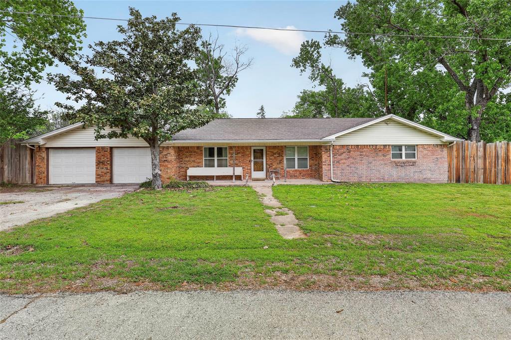 This home sits on over an acre and is a very inviting 3 bedroom, 2.5 bath home that offers space, functionality, and room to breathe. It features a great layout, and the kitchen has an amazing walk in pantry for plenty of storage, large living room and large bedrooms. The oversized garage has plenty of room for additional storage, separate area for the laundry, storage and a half bath. The backyard has an added covered porch for entertaining, or just enjoying the mornings with coffee or evenings enjoying peace and quiet. Within the tall private fence boosts a large 30x40 shop the has endless possibilities for projects, home business, or just simply tinkering. This rare find has so much to offer and is ready for you to make your own. Call for an appointment today and come see for yourself.
