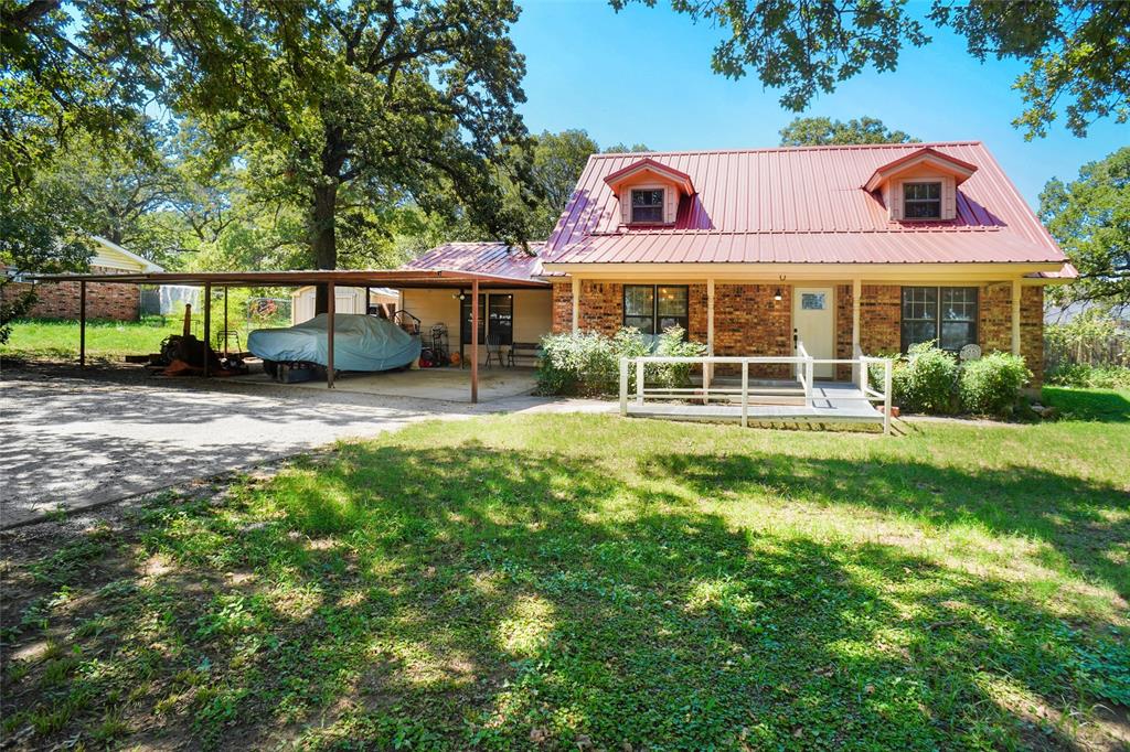 This 4-bedroom, 2-bath two-story home sits on .344 acres in the Lipsey Addition, directly across from the Wise County Fair Grounds. Key features include: Several new updates throughout the home. Mature post oak trees enhancing the yard's beauty. A 3-bay carport, storage building, jacuzzi area, and a pool house with a half bath. Open-concept layout with a spacious living area and a separate dining room. Kitchen boasts a large island with plenty of room for cooking and gathering. Complete with a pool, this home offers comfort, style, and outdoor enjoyment in a great location.