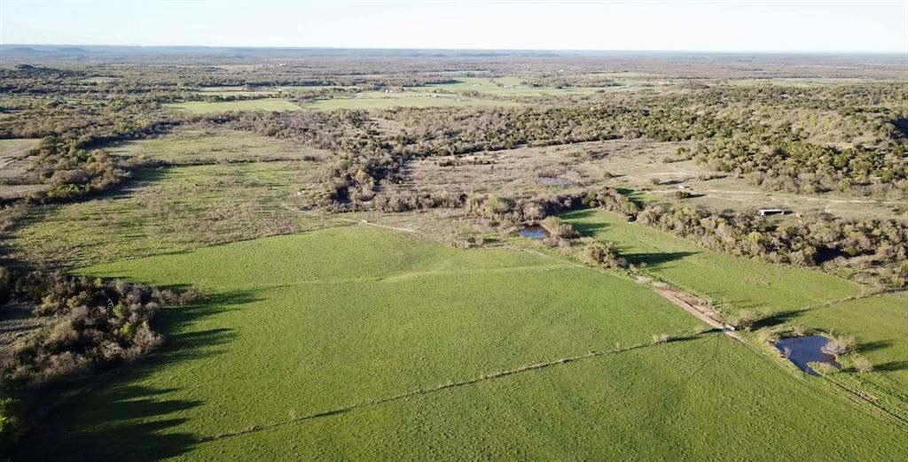 Perfect  weekend,hunting,recreational property. Incredible views from the front porch.  2 bed, 2 bath maintenance free main house with additional shed w electric for equipment storage or hay barn.  Four tanks, wet weather creek, cattle working pens, good fences and cross fences.  Good mix of woods and pastures.  Vistas must be seen to be appreciated 150 ft elevation changes, fantastic views to the south and west.  Close to I 20, easy access to the Metroplex.  Greystone Castle is nearby and Mary's Cafe in Strawn is 15 minutes away.