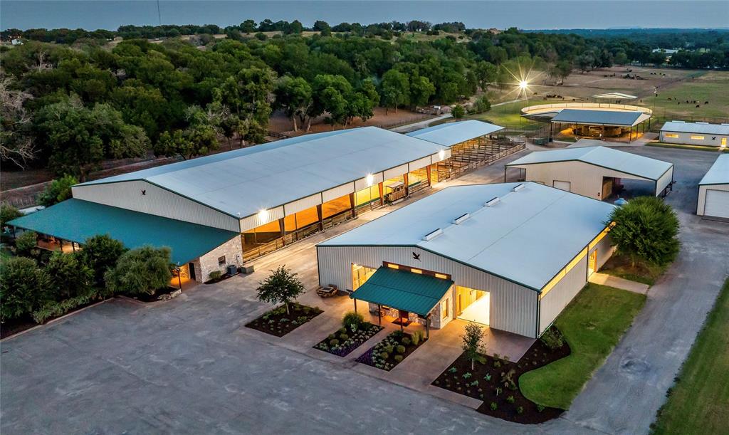 Introducing The Blue Heron Ranch. This well designed private ranch consist of just over 59 acres along the west side of Silverado on the Brazos. While its placement is inside the gated community of the popular development the property actually sits outside the restrictive covenants of the HOA. 

The facility is complete with twenty one tilt wall stalls, double tack room and office in the main show barn, five 20ft x 20ft stalls in the secondary barn, eleven oversized covered runs, 120ft x 150ft covered shell over the riding arena, 140ft outdoor lighten round pen, covered Priefert panel walker, four apartments, two bay drive through bus barn, commodity barn, paved driveway, double gated entrance, bronc pen, cattle pens, loading dock, and multiple top rail fenced pastures with loafing sheds.

Property owner can also layout a main home on the elevated partially treed lot on the east side of the facility with more than ample room for privacy and scenic views.