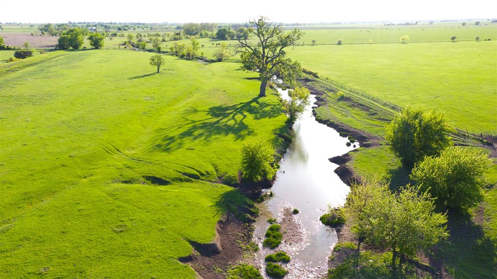 This exceptional hunting and cattle ranch in the heart of Texas is and exceptional property.  With 332 acres to roam, this unique ranch offers creeks, gorgeous old growth oak trees and its all easily accessible from Dallas or Austin. Nestled among some of the most beautiful terrain and ranches near Crawford, TX, this ranch with its size and features is indeed a rare find.  Fenced and cross-fenced, this working cattle ranch is set up with surface water and the ability to manage grazing patterns. An Additional 86 Acres is available with road frontage on Prairie Chapel Road.