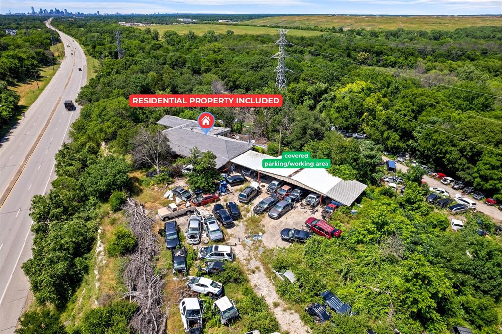 Creative financing available with seller carryback of up to 10% for qualified buyers, creating a rare opportunity to acquire a high-visibility commercial-industrial asset with added flexibility and leverage. Positioned along South Central Expressway in the rapidly expanding South Dallas corridor, this exceptional offering encompasses approximately 2.93 deeded acres and includes access to an additional four acres of adjacent Encore-owned land through a maintenance agreement, providing impressive scale for expansion, redevelopment, or long-term investment strategies.  

The fully fenced and graded site features approximately 9,868 square feet of existing improvements, including a metal warehouse, office space, and a separate residential structure that may support interim occupancy, operations, or administrative use. Zoned for commercial and industrial use, the property supports a wide range of business and investment possibilities with existing infrastructure in place, including water, electricity, septic, and internet access. Multiple driveways and a layout designed for heavy truck and trailer access make the site ideal for logistics, industrial operations, fleet storage, contractor use, or land banking. Immediate access to I-20, I-310, and I-45 places the property minutes from major transportation corridors, regional distribution centers, and the Dallas Inland Port. Currently operating as an income-producing auto salvage facility, the property offers immediate revenue potential while investors evaluate future repositioning or redevelopment opportunities. Opportunities combining location, acreage, income potential, and flexible financing are increasingly difficult to find. Contact us today to explore the full potential of this investment opportunity.