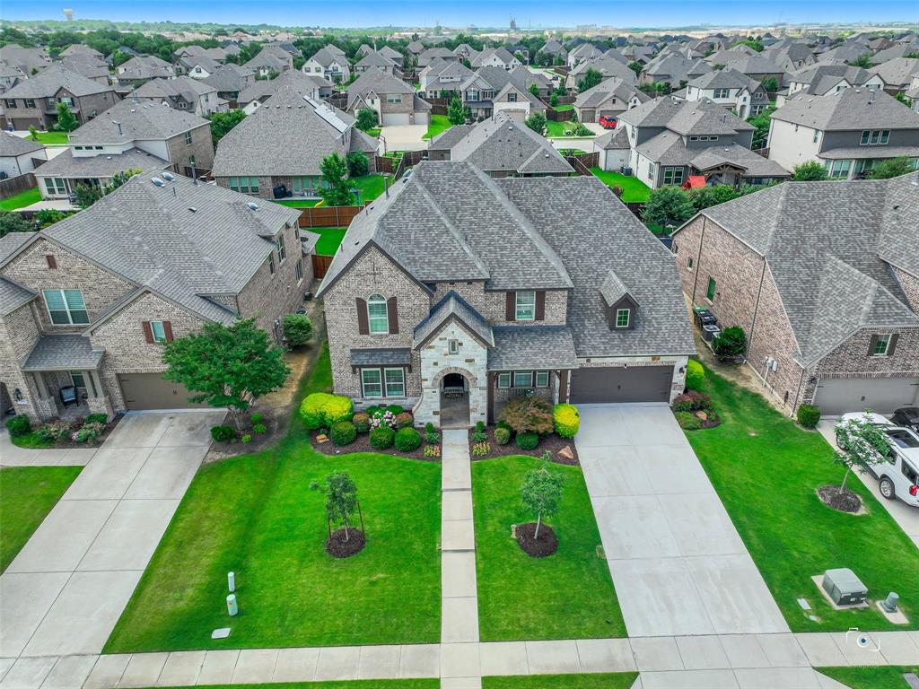 Welcome home to 411 Lake Trail Lane in the coveted Lakes of Prosper subdivision — where luxury, comfort, and lifestyle come together in one exceptional package. This stunning 3,945 sq. ft. home offers 5 bedrooms, 4.5 bathrooms, a private office, and 3 living areas, giving every member of the family their own space to thrive. With two bedrooms conveniently located downstairs, the layout is as functional as it is beautiful. The heart of the home is a showstopping island kitchen featuring GE Monogram gas cook top, double ovens, and an open floorplan designed for both everyday living and effortless entertaining. Brand new carpet throughout and fresh exterior paint give the home that move-in ready feel you've been searching for, while the epoxy-floored garage, board-on-board fence, solar panels, new roof, and tankless water heater check every practical box.  Step outside and prepare to be wowed — a gorgeous 36x14 foot pool awaits, perfect for Texas summers. And speaking of Texas moments, this home's location offers front-row views of the Prosper Fireworks celebration right from your own backyard. Forward-thinking buyers will love the EV charging station already in place, along with tons of storage throughout the home. Best of all — no PID, no MUD — keeping your tax burden refreshingly manageable.
Living in Lakes of Prosper means resort-style amenities just steps away, including a community pool, fishing, walking trails, a park, and year-round community events. The neighborhood is also just a short distance from Frontier Park, putting even more recreation and green space within reach.
This is more than a home — it's a lifestyle. Come see it for yourself.