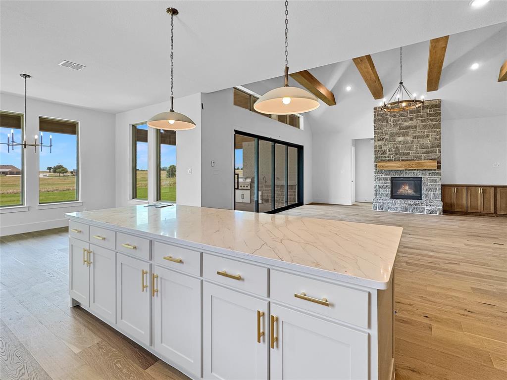 Very close to completion, your dream home on the fairway at The Retreat Country Club awaits.

Imagine waking up to sweeping views of the Brazos River Valley landscape; the big skies and the shimmering pond. This brand new golf course home is perfectly positioned on the fairway of Hole #5 at The Retreat, one of the most beautiful and challenging courses in DFW. Known for its big views and breathtaking scenery, this iconic par 5 is so striking with the largest water hazard and big bunkers.

Designed to fully embrace the setting, this new construction home features expansive windows, a large outdoor living area, and a gorgeous rear elevation to take it all in. The Hill Country inspired exterior blends seamlessly with the natural surroundings, while the interior is light, open, and warm. The beamed ceilings and flex spaces are an ideal balance of comfort and style. Just wait until you see the scullery!

Every detail has been thoughtfully selected, from the designer fixtures to the premium appliances, creating a space that truly feels like home. The flexible floor plan easily adapts to your lifestyle, with space to entertain or just relax and take in your views. They study is flexible and could become a golf simulator, reading room, yoga space…use your imagination.

The Retreat has beautiful views AND a great lifestyle. Towering limestone cliffs, roaming wildlife, bluebonnet and wildflower fields, hiking and biking trails, pickleball, an outstanding clubhouse and restaurant, and award-winning golf; every day truly feels like a getaway. The social scene includes book clubs, golf and pickleball groups, wine tastings, Links Fellowship, and more. There’s truly something for everyone.

Come experience it in person. Schedule your private tour today and see why this home and this community are so special.
