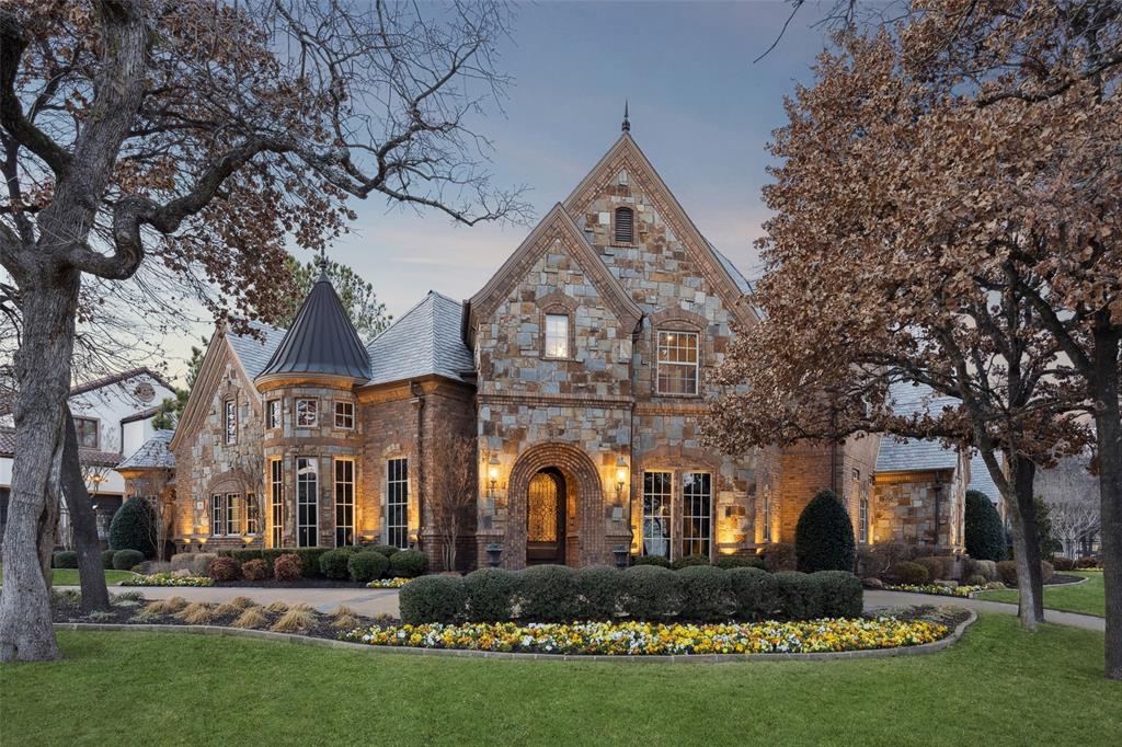 Welcome to 1800 Beam Drive, a masterpiece of timeless elegance spanning 6,144 square feet on over half an acre. This distinguished 5-bedroom, 6.5-bath residence features smart home integration and unparalleled craftsmanship throughout.
Enter through the soaring foyer with custom wood-and-stone flooring, an ornate wrought iron chandelier, and a dramatic curved staircase. The formal living room captivates with grand bay windows and a custom stone fireplace featuring fluted columns and intricate crown molding.
The sophisticated study features a dramatic rotunda dome ceiling, extensive built-in bookshelves, and a curved bay window reading nook. The expansive primary suite offers a multi-level tray ceiling, custom fireplace, pool-view sitting area, and bar with beverage refrigerator. The spa-inspired ensuite features diamond-cut stone floors, two custom vanities, a jetted soaking tub, walk-in shower, see-through fireplace, and grand walk-in closet.
The chef's kitchen delights with custom wood cabinetry, a gorgeous island, and professional Viking appliances including a 6-burner range with griddle, double ovens, two dishwashers, and a built-in Sub-Zero refrigerator. The adjoining wine room features brick accents, custom shelving, and premium wine storage.
Upstairs, discover three ensuite bedrooms with walk-in closets, a game room, and a tiered media room with projector and wet bar. The resort-style backyard showcases a custom lagoon pool with beach entry, spa, waterfall, slide, outdoor kitchen with Lynx grill, and covered loggia with stone fireplace—all surrounded by mature landscaping. A circular drive and four-car garage with epoxy flooring and electric car charger complete this extraordinary home.