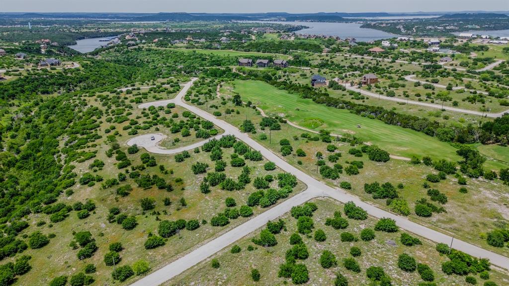 Discover the perfect opportunity to build your dream home on a prime lot in Cypress Point at Possum Kingdom Lake! Located within the prestigious Cliffs Resort, this spacious homesite offers a serene setting surrounded by natural beauty, with the added benefit of being in one of Texas’ premier lakefront communities. Residents of The Cliffs enjoy access to an impressive lineup of resort style amenities, including an 18 hole championship golf course with breathtaking lake views, two swimming pools, a full service fitness center and spa, and an on site bar & grille for dining and entertainment. The community also features a private marina with boat ramp and slips, tennis courts, scenic hiking trails, and gated security for peace of mind. Whether you’re planning a weekend getaway or a full time residence, this lot offers an exceptional setting to enjoy the relaxed lifestyle and wide open beauty of Possum Kingdom Lake. Ownership includes access to all resort amenities along with 36 rounds of golf per year. Don’t miss your chance to secure your spot on Cypress Point at The Cliffs.