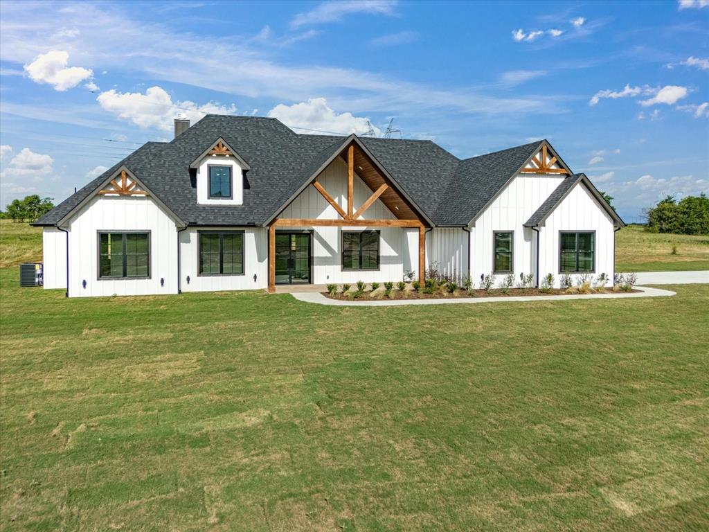 $10,000 Seller’s Credit Available!
Use it toward a rate buy-down or down payment assistance on this BRAND NEW modern farmhouse completed in May 2026!

Situated on 5 beautiful acres in the desirable Ranches at Rolling Hills, this stunning 4-bedroom, 3-bath home with a 2-car garage combines luxury finishes with peaceful country living. The exterior showcases beautiful Hardie Boards and cedar beam accents that perfectly complement the home’s modern farmhouse design and curb appeal.

Inside, you’ll find engineered white oak wood flooring and tile throughout, along with a warm and inviting living room featuring a cozy fireplace. The open-concept layout flows into a chef’s kitchen designed to impress, complete with a huge quartz island, brand-new KitchenAid appliances, pot filler, soft-close cabinetry, and an oversized pantry with exceptional storage.

The primary suite offers vaulted ceilings and charming wall-mounted reading lamps, creating the perfect retreat. The luxurious ensuite bathroom includes an oversized walk-in shower with inset seating, garden tub, double vanity, separate toilet room, and a large walk-in closet.
Outside, enjoy fresh sod, a concrete driveway, and a beautifully paved back patio ideal for relaxing or entertaining while taking in the scenic surroundings.

This modern farmhouse offers the perfect blend of upscale comfort, style, and acreage living.