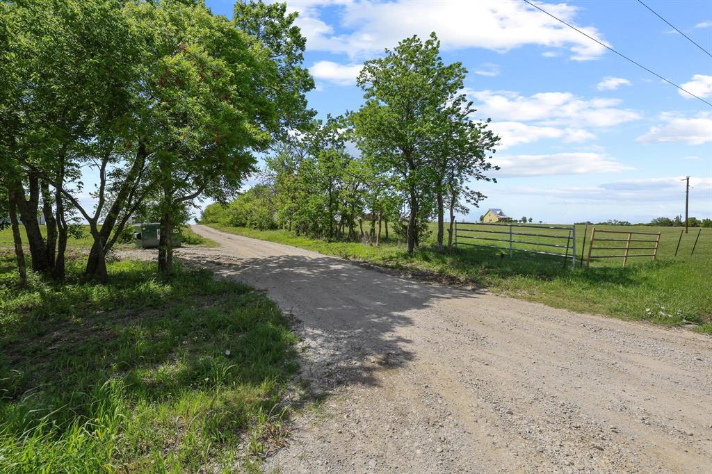 Seller finance available with 10% down! Discover the perfect blend of open space and natural beauty on this picturesque 15 acre property. Build your custom home here, keep horses or cattle, or hold as a long-term investment as North Texas continues to grow. The land features open space and some absolutely beautiful trees, a seasonal creek in the back woods. Ultimate privacy with no neighbors in the back, just natures beauty for your enjoyment. Live underneath the millions of stars over Texas...build, camp, make a weekend getaway, recreational activities, put some livestock on it....so many options here! Enjoy the wide open space and unwind here. Make this your homestead and grow a garden even! It's an amazing canvas for your creativity to turn visions into a reality. Contact your favorite REALTOR to tour it today! Shared driveway entrance with one neighbor. SHOWN BY APPROVED APPOINTMENT ONLY.