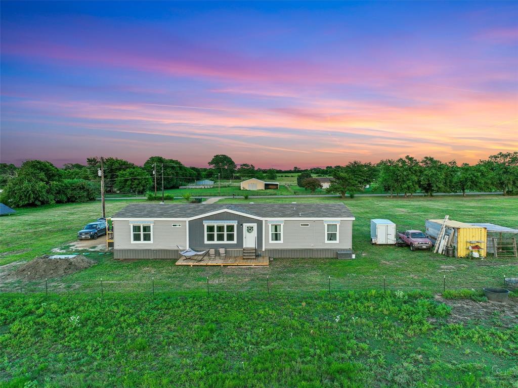 Welcome to your slice of Texas countryside! This beautiful 12-acre property in the Luella area of Sherman offers endless possibilities. At the front of the land is a 2022-built, double-wide home featuring 5 bedrooms & an open floor plan—move-in ready while you plan your next steps. The placement of the home allows the majority of the acreage to remain open for your vision: create a family compound, establish your dream homestead, run a small farm, or explore development potential with multiple custom homes.
The land itself is peaceful and picturesque, with open views and trees surrounding the back of the property that make it feel like your own private retreat. For those dreaming of a homestead lifestyle, there’s ample space for livestock, gardening, and more—the current animals may even convey if desired.
At the same time, you’ll enjoy unmatched convenience. Located just 8 minutes from I-75, this property provides quick access to all that Sherman has to offer, including the new Texas Instruments plant, Sherman Municipal Airport, shopping, dining, and schools. It’s an ideal balance—quiet country living without sacrificing proximity to town or the DFW metroplex.
Whether you’re looking to spread out and enjoy the land, start a self-sufficient lifestyle, or explore the opportunities for small-scale development, this property checks all the boxes. Come see why so many are drawn to the charm and potential of Sherman’s countryside.