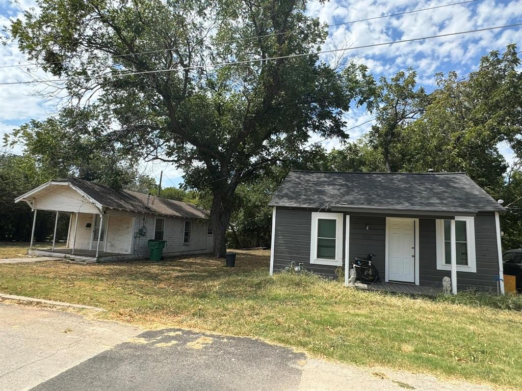 Investors take a look! Two houses on one lot for sale!! One house has been updated and has served as a rental for $1100 month. The second house needs to be fixed up and remodeled but has lots of potential! The grey house is a 1 bedroom 1 bath and super cute! Comes with all appliances. The homes are located on a corner lot on a quiet street directly across from the walking trail! This is perfect for an investor who wants to already have an income stream in place as they fix up the second home! The remodeled home has the address of 580 Minter. The house that needs to be fixed up has the address of 588 Minter. The footprint of 588 Minter is required to stay the same per the city of Stephenville.
Come see the possibilities! The pictures of the finished house are for the grey, remodeled house. The pictures that show necessary remodel are of the white house on the same lot.
