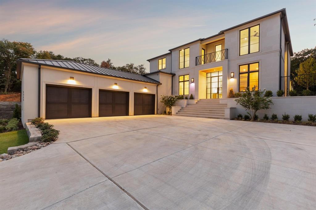 Discover the charm of this exquisite Heritage Home in the sought-after gated community of The Knolls in Westlake. Enter through the breathtaking foyer adorned with wide plank white oak floors, leading you to a striking floating staircase. The spacious design allows for gatherings, while the sophisticated kitchen, equipped with soft-close cabinets and drawers, elegant quartzite countertops, designer lighting, and top-of-the-line Wolf-SubZero appliances, appeals to those with a taste for luxury. Experience the catering kitchen equipped with a ice maker, steam oven and warming drawer. Indulge in the opulent master suite boasting a custom closet and a lavish bathroom featuring Calacatta Gold Marble with his and her vanities and a steam shower. Step into the backyard and find a secluded paradise bordered by a lush greenbelt, featuring a custom pool and spa. The covered patio, enhanced with motorized screens, heaters, and an outdoor kitchen, sets the stage for unforgettable summer evenings.