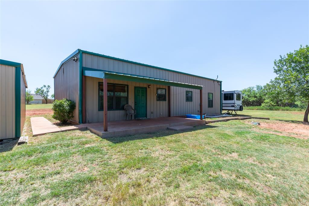 Escape to peaceful country living with this beautiful 3-bedroom, 2-bath barndominium situated on 7.44 scenic acres in Jim Ned ISD. Overlooking a picturesque tank and surrounded by mature trees, this property offers the perfect blend of privacy, functionality, and endless potential.
The 1,515-square-foot home features 3 bedrooms, 2 bathrooms, durable steel construction, 12 inches of insulation for year-round energy efficiency, stained concrete floors throughout, and an inviting open-concept layout designed for comfortable country living. Whether you're looking for a full-time residence or a peaceful retreat just outside of town, this property is ready to make your vision a reality.
Outside, you'll find a 300-square-foot two-car carport attached to approximately 400 square feet of enclosed shop and storage space, providing plenty of room for tools, equipment, hobbies, or extra storage. The property also features an aerobic septic system, ample parking, and plenty of space to park or hook up an RV.
Enjoy quiet mornings overlooking the tank, relaxing evenings under the West Texas sky, and all the privacy that comes with owning your own slice of the country. If you've been searching for acreage with a move-in ready home and room to spread out, this property is one you won't want to miss. Schedule your private showing today!