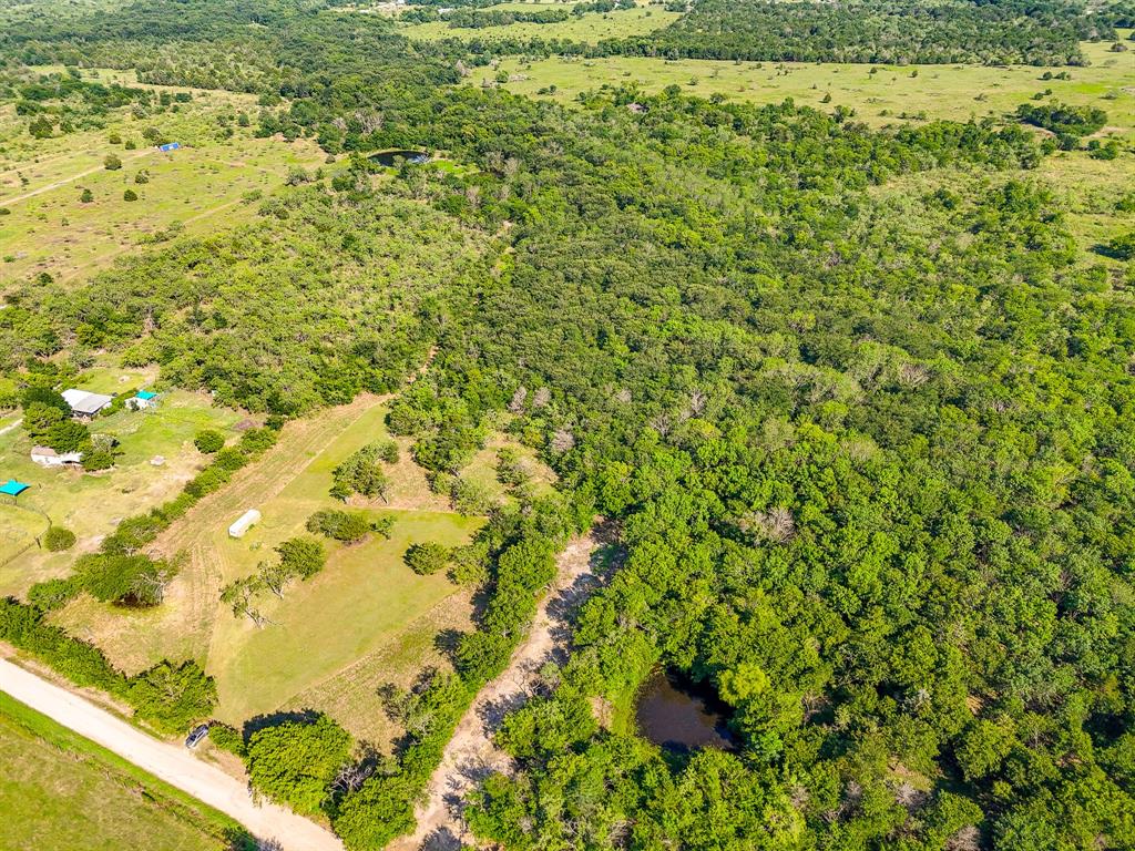 Discover the perfect blend of recreation, privacy, and potential on this beautiful 21.46-acre tract. Currently utilized as a hunting property, this fully fenced acreage features a gated entrance, mature trees, established trails, and open clearings throughout. Game camera photos included with the listing showcase deer frequently visiting the property, making it an excellent recreational retreat for outdoor enthusiasts.
Beyond its recreational appeal, the property offers several potential homesites for those looking to build a custom home, barndominium, or weekend getaway surrounded by nature. Enjoy peaceful country views, privacy, and plenty of room to roam while remaining conveniently located near Kerens, Corsicana, and Richland-Chambers Lake. Whether you're seeking a hunting retreat, future homesite, or investment opportunity, this versatile property offers endless possibilities.