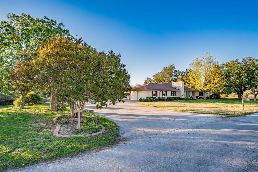 Come home to this beautiful 4 bedroom, 3 bath property spanning over 2.6 acres!  Nestled in a quiet neighborhood with lovely surroundings, from nature sounds to stunning sunsets, you will enjoy the peaceful and serene landscape. As you tour the home you will find so many options with a TV room, game room, office and multi use basement room, the possibilities are endless. It is perfect for working remotely, homeschooling, entertaining and relaxing. Cozy up in front of the wood-burning fireplace or chill out on the vaulted covered porch with a scenic view. Even take a dip in the hot tub that’s included with the property! The huge workshop is ready for all your home and auto projects. Many updates including new carpet, remodeled master bath, fresh paint, and so much more.  Don’t miss this amazing opportunity, call today!