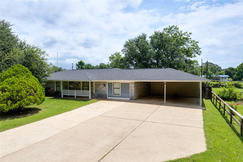 MOTIVATED SELLERS! Charming country home situated on approximately 0.5 acres in Mount Pleasant, Texas. This well-maintained 3-bedroom, 2-bath residence offers a comfortable layout with spacious living areas, generously sized bedrooms, and updated bathroom vanities. The kitchen features abundant cabinetry, ample countertop space, a breakfast bar, and an adjoining dining area ideal for everyday living and entertaining. Additional highlights include a dedicated utility room, covered back patio, mature shade trees, and a large backyard with plenty of room for outdoor activities, gardening, or future improvements. Enjoy the peace and privacy of country-style living while remaining conveniently located near local shopping, dining, and schools. Buyer and buyer's agent to verify all information contained herein.