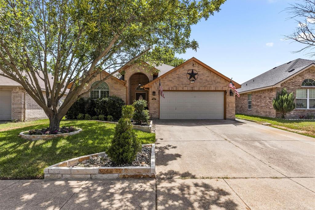 Welcome home to this beautifully maintained single-story home in the heart of Waxahachie.  From the moment you arrive, the charming curb appeal and pride of ownership are unmistakably evident. Step inside to find a thoughtful layout designed for both comfortable daily living and effortless entertaining. The spacious living area includes gorgeous wood flooring that adds warmth and elegance to the home. The true centerpiece of the home is a stunning, double-sided brick wood-burning fireplace connecting rooms while creating a cozy, sophisticated atmosphere you'll love coming home to. This highly desirable single-story floor plan includes three bedrooms and two baths. Whether you are enjoying a quiet evening or hosting family and friends, this property offers the perfect blend of Texas charm and modern comfort. Don't miss the chance to make this Waxahachie treasure your own!