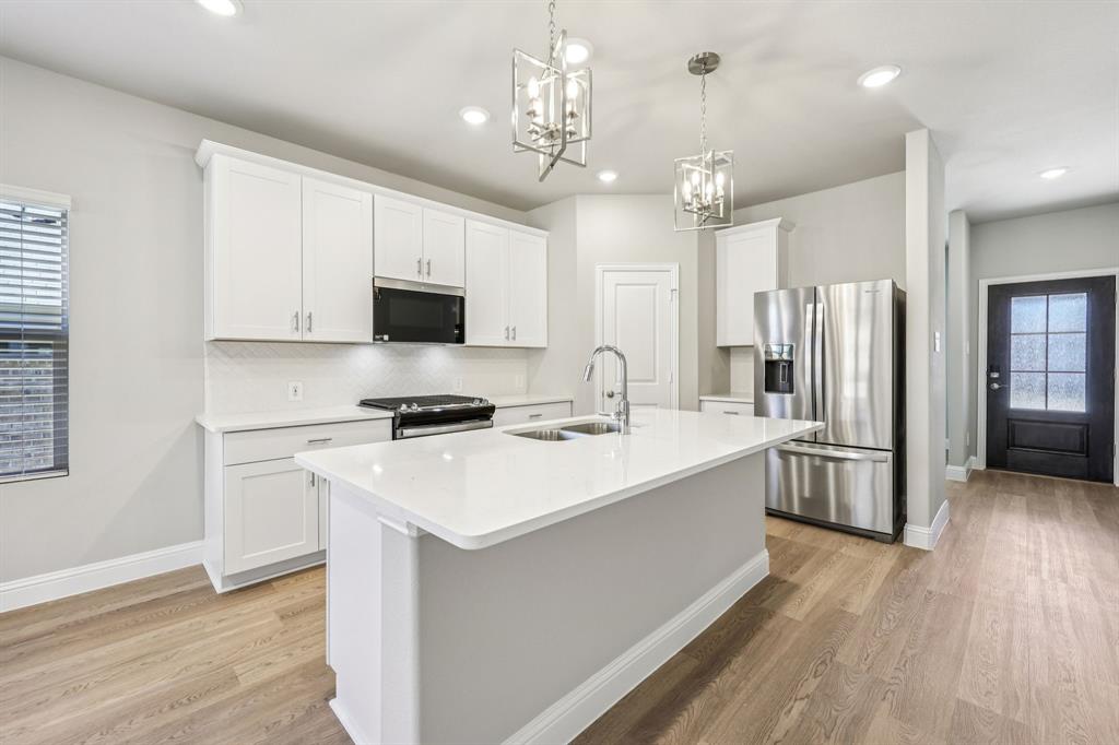 BRAND NEW energy - efficient home Sep 2026! Sip your morning coffee at the Henderson's convenient kitchen island overlooking the dining and family rooms. Pebble cabinets with marble-look white granite countertops, beige tone EVP flooring and multi-tone grey carpet. New energy-efficient move-in ready homes in Dallas-Fort Worth include a washer, dryer, fridge, and whole home blinds, plus they can be closing-ready in 60 days or less–guaranteed. Have it all: Relax in your private primary suite, enjoy the covered back patio, and our open concept floorplans, all with easy access to Fort Worth, Arlington, and Grapevine.