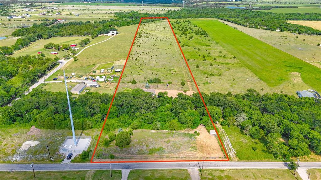 Escape to the peace and privacy of country living with this 3 bedroom, 2 bath double wide mobile home situated on 15 beautiful acres in Waxahachie. Tucked away behind a long private driveway that crosses over a creek, this property offers a secluded setting surrounded by nature and endless possibilities. The 1,120 sqft home features a covered front wood deck perfect for enjoying quiet mornings and relaxing evenings in the countryside. While the home does need some TLC, it presents a great opportunity to customize and make it your own. The property also includes an 8x8 storage shed for extra storage space and is partially fenced, offering potential for livestock, recreation, or future improvements. The property is currently ag exempt with 10 bee hives in place, offering added value and potential tax benefits. Whether you’re looking for a fixer-upper investment, a weekend retreat, or a place to build your dream country homestead, this acreage property combines privacy, character, and room to grow just outside the city limits.