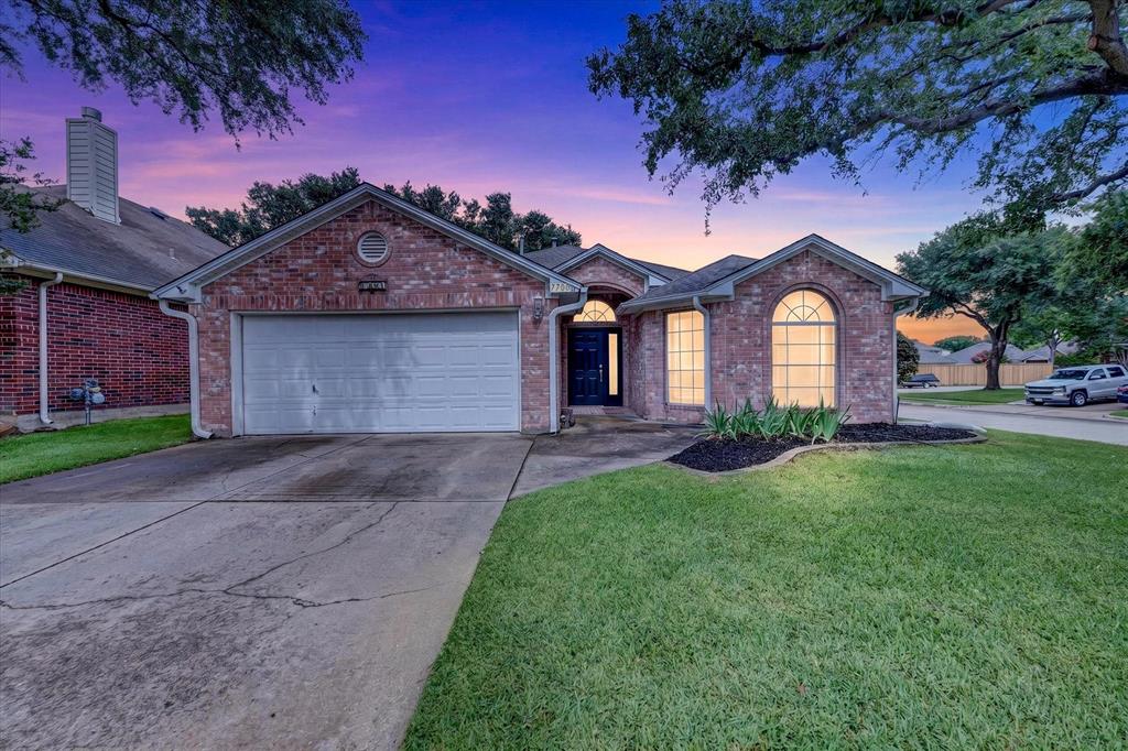 Beautifully refreshed 3-bedroom, 2-bath home on a cul-de-sac lot in Keller ISD, just one block from walk-up access to Arcadia Park with walking, jogging and bike trails, disc golf, basketball, tennis, playgrounds and more. Inside, tall ceilings create an open feel, and the kitchen features painted cabinetry, new subway tile backsplash, new electric cooktop, Bosch dishwasher, island, and abundant cabinet and countertop space. The primary suite includes a double vanity, large tub, and walk-in shower. Additional features include a tankless water heater, sprinkler system, 240V garage outlet for EV charging, privacy fence, trimmed trees, maintained lawn, and recently painted storage shed. Exterior door has been updated. Lennox HVAC system installed in 2018 with documentation showing warranty expiration in 2028; buyer to verify coverage and transferability. Roof documentation shows GAF Timberline Armorshield II Class 4 impact-resistant shingles installed in 2022. Move-in ready with valuable updates and an excellent Park Glen location.