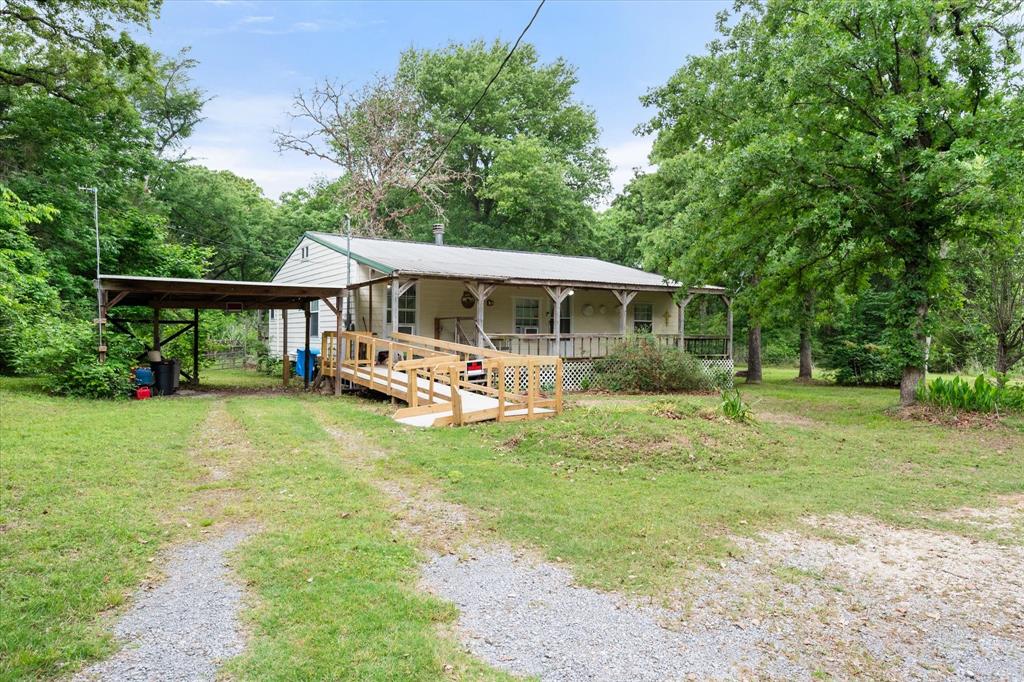 Home and workshop with small apartment on 2.5 shady acres in Fairfield. House has 2 bedrooms, 2 bathrooms, eat-in kitchen, large living room with wood burning stove, laundry room, covered front porch and partially fenced yard. Kitchen has nice cabinets, gas cooktop and dining area and is open to the living room. There are French doors from dining area to a space that can be used as a sun room or pantry. Primary bedroom has a large walk-in closet wide doorways for wheel chair accessibility into bathroom. Second bathroom has large soaking tub with jets but seller is not aware if they are in working order. There is no closet in second bedroom but a free standing wardrobe is available. House has AC duct work but units are not currently used and are in need of inspection, and possible replacement. The 56 X 23 shop has electricity and water and contains a small apartment in the front with a living area, bathroom, kitchenette and closet. The apartment opens up into a nice small fenced yard. You will find options and potential in this property! Property will be sold as is. There are projects needed. Information provided is deemed reliable but not guaranteed. Buyer and buyers agent should verify.