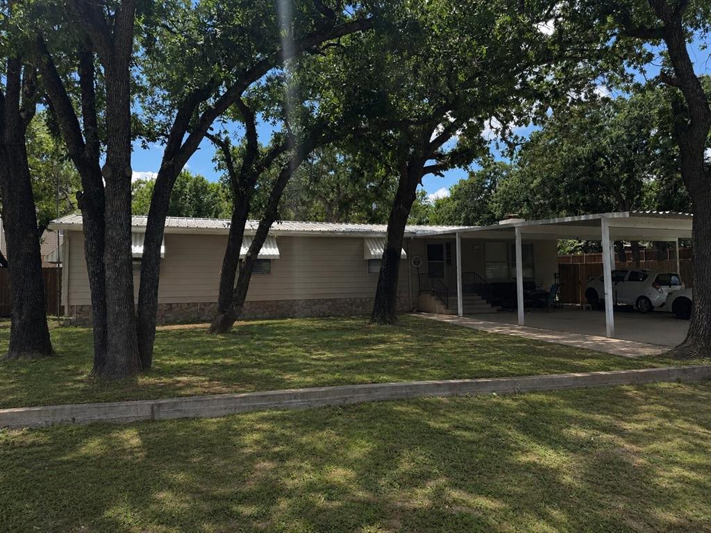 great Curb appeal, big trees, fenced yard big walk in closets and pantry. Nice rock fireplace,wood floors and lots of storage. Sits on 3 lots; lots included: 177, 178 & 179.