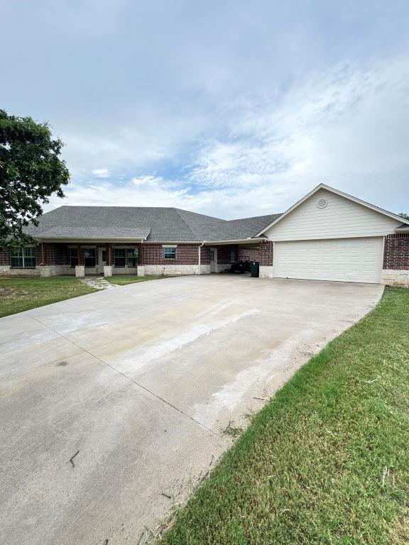Experience refined country living at 153 Twin Springs Ranch Ln, nestled on 14.3 sprawling acres in scenic Weatherford, TX. This updated 2,716sq ft, single-story traditional brick home offers a delightful balance of comfort, functionality, and rural charm.

Featuring 4 Bedrooms + Bonus Study 2.5 Baths
- Spacious primary suite with full bath-and three additional bedrooms plus a bonus study ideal for home office or hobby room.
- Two full baths and a thoughtfully placed half-bath for guests.

Stylish Living & Entertaining
- A bright, inviting living area centered around a wood-burning fireplace.
- French doors open to a large covered patio, seamlessly connecting indoor and outdoor living spaces.
- Eat-in kitchen boasting granite countertops, electric cooktop, oven with air frying capability, dishwasher, disposal, stainless steal fridge, and microwave- all ready for family gatherings or casual meals.

Outdoor Oasis & Ranch-Ready Land
- Sparkling private pool with diving board, rock waterfall, and adjacent spa- perfect for relaxing or entertaining.
- Fully fenced and cross-fenced property with barbed wire, pipe, and iron fencing- ideal for horses, livestock, or recreational ranching.
- Extras include well and septic system, 3-car detached garage, carport, and a practical slab foundation.

Additional Home Comforts
- Forced-air central heating and cooling with full-size washer-dryer area.
- Water softener, mix of laminate, carpet, and tile floors throughout.
- A cozy wood-burning fireplace.

Location & Convenience
- Peaceful, spacious setting nestled in the Twin Springs Ranch subdivision of Parker County, offering privacy and the allure of expansive ranch life.
- Easy access to Weatherford's schools, shopping, dining, and minutes from I-20, ideal for a commuter or weekend retreat.