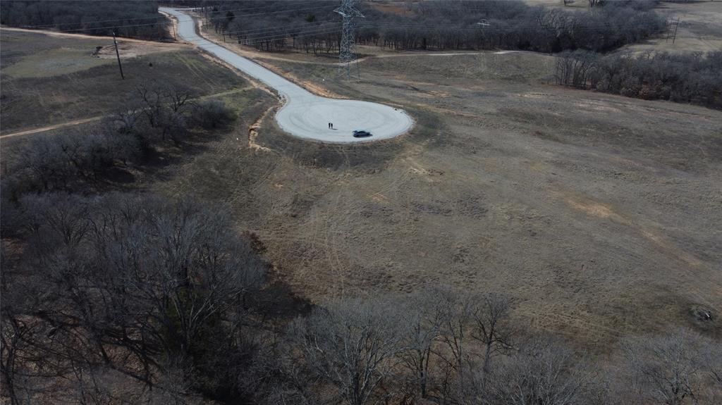 Come build your dream home on 2.868 acres in beautiful Alvord, TX! The Ranches at Rolling Hills is an easy drive from the DFW Metroplex and
just minutes away from historic downtown Decatur. Ranches at Rolling Hills amenities include 16-plus acre community park, two fully stocked fishing ponds. Property owners can enjoy the nearby 250 acres of the LBJ National Grasslands, the perfect spot for horseback riding, bird watching and nature hikes. This beautiful lot is located in a cul-de-sac and has already been partially cleared for your new home, nestled amongst the trees! Barndominiums and livestock are allowed, come see all that this amazing community has to offer. Your dream home is waiting!!
