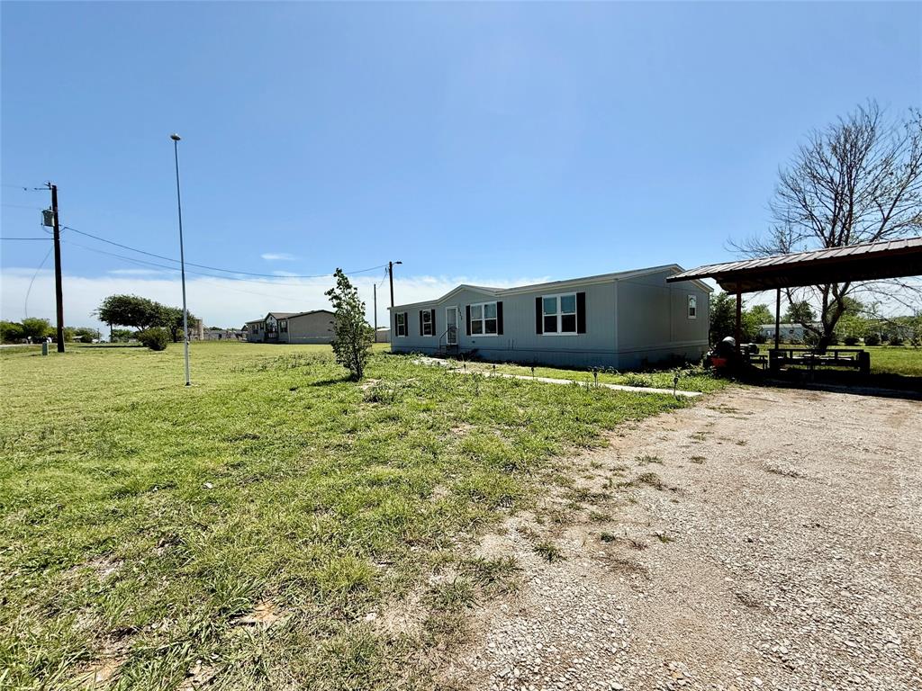 2024 mobile home on 1 acre in Haslet, located in Northwest ISD. This well-maintained 4 bedrooms, 2 bath home offers a spacious open-concept layout that connects the living room, dining area, and kitchen, great for everyday living and entertaining. The kitchen is bright with large windows, features upgraded appliances, plenty of cabinet space, separate walk in pantry, and a functional layout that opens to the main living area. The private primary bedroom is split from the secondary bedrooms for added privacy.  Outside, enjoy the large 1 acre lot with no HOA, a covered carport, workshop, and materials ready to finish your outdoor pergola.  The back deck is perfect for grilling and relaxing. Clean, move in ready, and full of space! Campion Prime Series