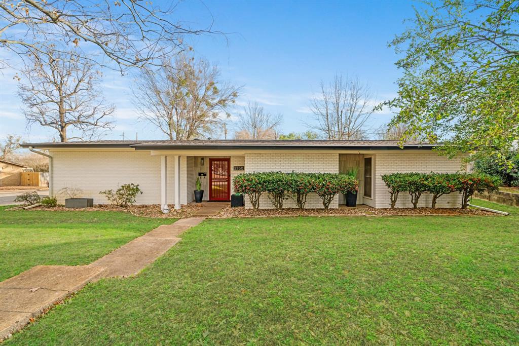 Beautifully updated 3-bedroom, 2-bath home on a desirable corner lot, offering extra space, privacy, and fantastic curb appeal. As you step inside, you're greeted by a stunning open floor plan that feels light, spacious, and perfect for modern living. The heart of the home is the living room, featuring raised ceiling, luxury vinyl flooring, and an abundance of windows that bathe the entire space in natural light. The kitchen boasts sleek stainless steel appliances, luxurious Brazilian marble countertops, ceramic mosaic tile, and seamless flow into the living and dining areas.  Cozy primary suite features custom cabinets and en-suite bath. Step outside to your private covered patio, the perfect spot for morning coffee or relaxation.  Back yard features privacy fence and storage building with extra garage and workshop.  Don't miss this one!