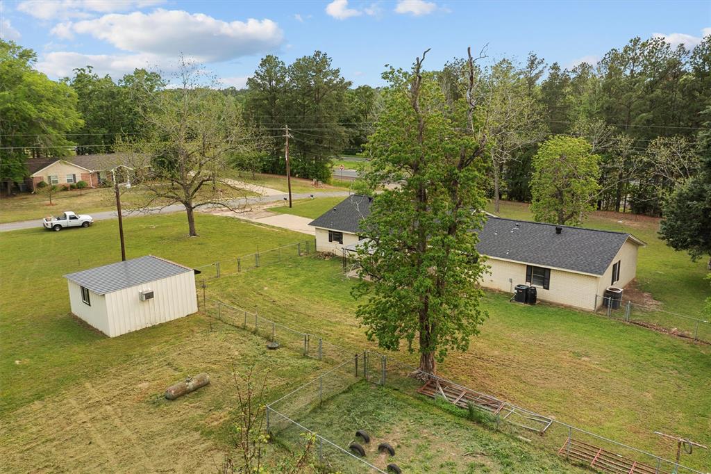 OPEN HOUSE is rescheduled for next Sunday, 6-14-26 from 1-3pm. Welcome to 155 Angela Ln! What an amazing property with so many possibilities! Discover the charm of this beautiful home, nestled on a generous nearly 3-acre parcel, just a few minutes from downtown Henderson, TX. The property has so much to offer, boasting 1898 sf, 3 bedrooms, 2 full baths and 2 car garage. Upon entering, you are welcomed into a spacious living area, the open floor plan seamlessly connects the living room, dining area, and kitchen, making it an ideal space for both entertaining and everyday living. Spacious master suite features a full bath. 2 more bedrooms share a hall bath. The backyard is fenced into several sections and provides endless opportunities for relaxation & outdoor entertainment, featuring a covered patio, 18x18 heated & cooled workshop & a storage shed. Convenient access to schools, shopping, and dining, well established neighborhood and close to city. Recent upgrades include: roof, flooring & paint (December 2023). Schedule your tour today!