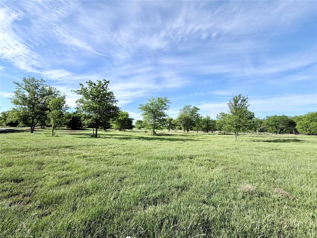 Located within the city limits of Whitney, Lot 17 offers 3.163 acres with a natural mix of trees and open space, allowing flexible home placement. Lakewood Acres features a private gated entrance, chip sealed road, City water, and underground electric. Deed restrictions mirror City of Whitney regulations. A peaceful setting with deer and birds just minutes from town.
