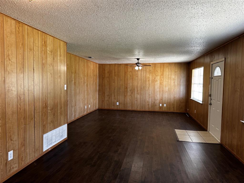 Recently was repainted and had new flooring installed. Washer, Dryer hook up in unit. Fenced backyard. Storage Unit in the backyard. This half duplex features 3 bedrooms and 2 bathrooms, a well-equipped kitchen with washer and dryer hookups, a spacious living room, and a fenced backyard with a storage shed.