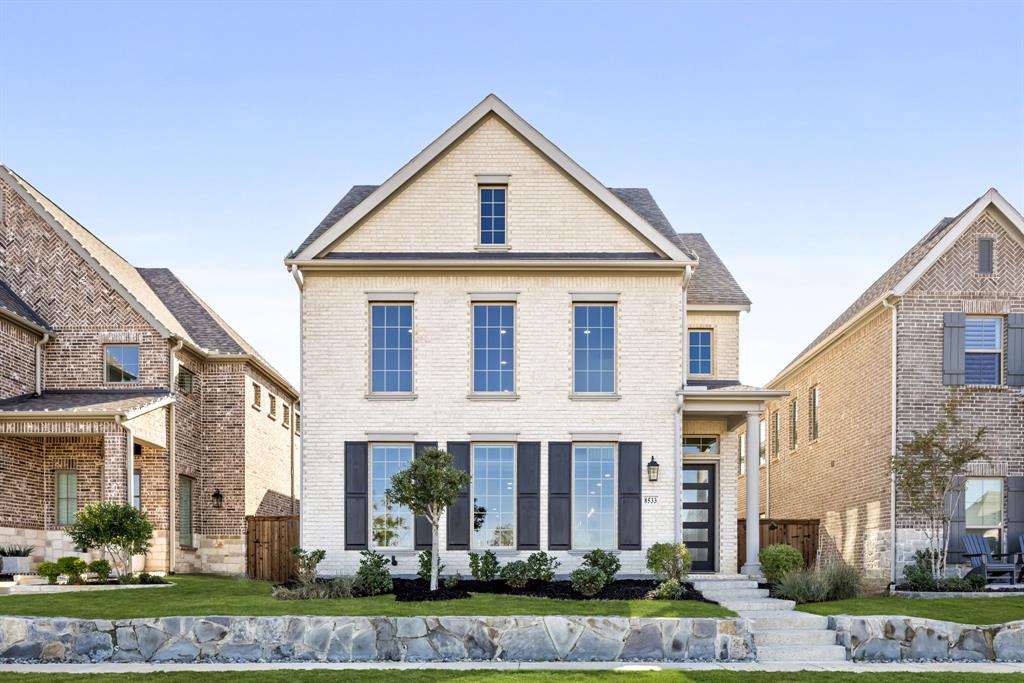A rare offering in The Tribute with unobstructed lake views and direct access to walking trails along the water just outside your front door. This Perry Homes design features soaring ceilings and a wall of windows that bring in natural light and showcase the views.

The main living area is designed for both comfort and entertaining, with a two story family room anchored by a fireplace and open to the kitchen and dining. The kitchen offers an oversized island with seating, 5 burner gas cooktop, and a walk in pantry. The primary suite is privately located on the main level and offers a spacious bath with dual vanities, soaking tub, separate glass enclosed shower, and a large walk in closet.

Upstairs, an oversized game room captures elevated lake views and provides flexible space for media or gathering. A private guest suite with full bath is complemented by three additional secondary bedrooms connected by a Hollywood style bath. Outdoor living includes a covered patio and a turfed side yard for low maintenance enjoyment.

Located in The Tribute, residents enjoy resort style amenities including golf, pools, a marina, and miles of lakeside trails. One of the only homes on the market with this combination of view, access, and layout.