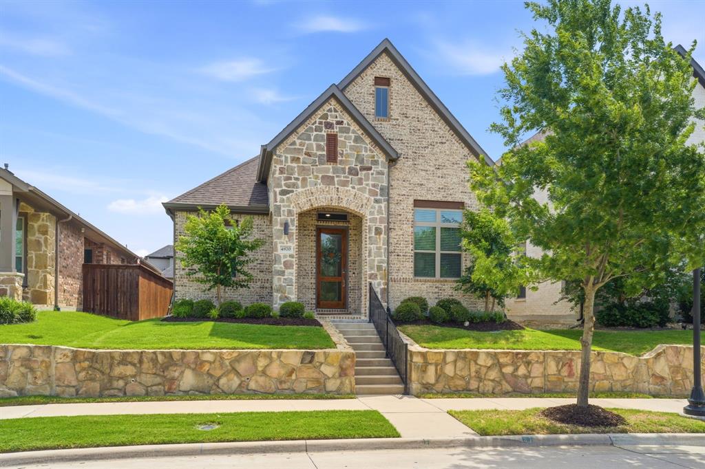 This stunning, lightly lived-in 3 bed, 2 bath home could be the one you've been waiting for! Located directly across from the community lake, this home offers a tranquil setting combined with luxe amenities such as light wood flooring and 12-foot ceilings which adds to the airy, open feel. The crisp white cabinetry and quartz counters are the foundation for a true chef's kitchen with a 5-burner gas cooktop vented outside, a convection oven, built in wine refrigerator, and a single bowl stainless sink. The large island provides seating for 4 while the adjacent dining area can accommodate a larger seating. Relax in the spacious family room with its built-in fireplace or enjoy the covered extended patio and side yard with low maintenance turf. This home boasts an impressive, private master retreat with his and her closets, dual vanities with knee space, an oversized shower and ample linen storage. Two secondary bedrooms are located at the front of the home and have good closet space. The previous owner added a 11X10 enclosed, air-conditioned storage space in the attic perfect for storing your seasonal items! Other features include 8-foot doors throughout, tankless water heater, flat screen wiring, window coverings and treatments, and some smart home features.