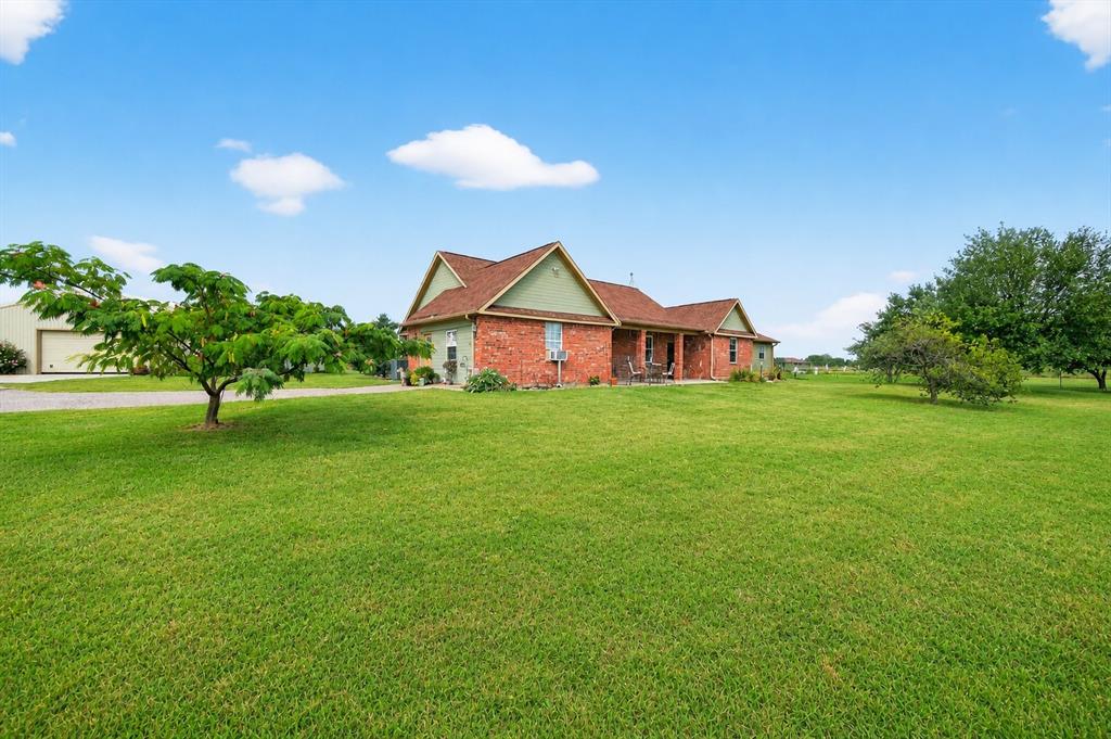 Welcome to a truly special North Texas property where scenic beauty meets functionality and long-term opportunity. Perched on a gentle hilltop, this 9.9-acre retreat offers sweeping views of your private pond and surrounding countryside—creating a peaceful setting that feels both private and expansive. A tree-lined crushed granite driveway leads to a charming 1,855 sq ft home. Designed with comfort and livability in mind, the home features 3 bedrooms, 2 bathrooms, and a versatile flex room that can easily serve as a home office, guest space, or hobby room. Inside, the open-concept layout is enhanced by vaulted ceilings and an abundance of natural light, creating a bright and airy atmosphere. The kitchen and living areas showcase custom cabinetry and thoughtful finishes, while hardwood floors throughout most of the home add warmth and durability. With ample storage and a functional layout, the home is perfectly suited for both everyday living and entertaining. Step outside and take in the true beauty of the property. The pond offers a tranquil focal point, ideal for relaxing, fishing, or simply enjoying the view. The land is well-suited for a variety of uses, with open space for recreation and established infrastructure for agricultural or livestock needs. Well-fenced pastures make this property ideal for horses or livestock, while a dedicated workshop provides space for equipment, tools, or projects. Adding even more versatility, a separate guest home offers private accommodations for family, visitors, or potential rental income—an increasingly valuable feature for today’s buyers. With the ability to subdivide into smaller tracts, it presents an excellent opportunity for investment, development, or multi-generational living. Whether you're seeking a peaceful homestead, a recreational getaway, or a property with income and development potential, this hilltop retreat delivers a rare combination of lifestyle, flexibility, and long-term value.