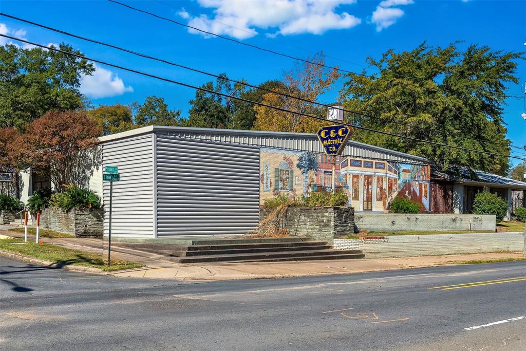 Prime commercial opportunity in the heart of Shreveport! This expansive property offers over 11,000 square feet of usable space situated on 1.5+ acres, providing exceptional flexibility for a wide range of business operations. The site features two commercial buildings connected by a covered breezeway and a shared courtyard, creating a seamless flow between structures while allowing for diverse functional use.
Enjoy an open layout ideal for retail, office, event, or service-based businesses. A private gated access drive and ample parking—enclosed with a striking black wrought-iron fence—offer convenience, security, and professional appeal. Located in a high-traffic corridor, this property delivers outstanding visibility and accessibility for customers and clients.
A rare chance to secure a high-exposure commercial property with exceptional space, layout, and location. Perfect for an expanding business or a new venture ready to thrive in Shreveport’s vibrant commercial district.