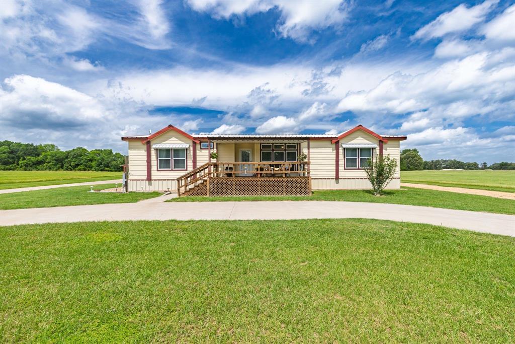 Bass boats, back porches, the East Texas dream. Coffee on the back porch, boat hooked up and ready for mornings on Lake Fork bass fishing! Situated on 5.74 private acres in Alba. 2020-built home, easy flow, and plenty of room for both people and projects. Split floor plan offers 3 bedrooms, 2 full baths, open living to kitchen area with custom touches throughout, including shiplap accents, granite countertops, generous storage, and natural light. primary suite features double vanities, walk-in shower, dedicated makeup area, and storage in all the right places. Even the laundry room was thoughtfully planned with a sink and drip-dry space. Outside is where this property really starts to separate itself. The insulated 50x40 shop with electric has two roll-up doors, walk-through access, and space already framed for a future 12x12 bathroom. There’s also an additional 20x20 metal building with electric, roll-up door, and walk-through door, ideal for equipment, hobbies, side work, or serious boat storage. Concrete driveway, huge carport, metal roof, covered front porch, massive covered back porch. Everything here feels clean, solid, and well cared for. Bring horses, a few cows, four wheelers, fishing gear, campers, or all of the above. Being this close to one of the nation’s premier bass fishing lakes makes this setup especially hard to find. Convenient to Emory, Mineola, and Sulphur Springs, but it still feels tucked away from the noise. Just a really good East Texas property with space to live, work, fish, store the toys, and enjoy the quiet.