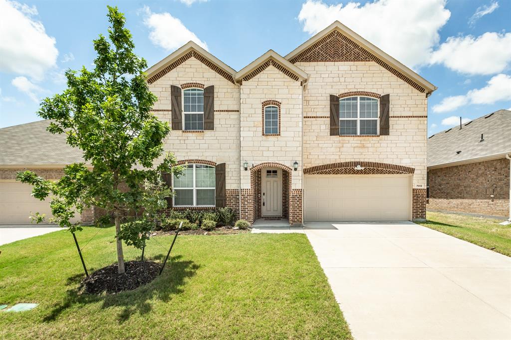 Built in 2024 and still feels like move-in day — 7013 Black Ash Lane is a like-new 5 bedroom, 4.5 bath home in McKinney's Shaded Tree community, offering 3,838 square feet of thoughtfully designed living space in a great location. NO MUD or PID. The main level delivers a primary suite with a spa inspired bath featuring dual sinks, a separate shower, and large soaking tub, plus a second bedroom with an ensuite bath ideal for multigenerational living or guest privacy. Beautiful French door entry office gives you space to work from home and a large living area with corner fireplace is the perfect place to unwind. The open concept kitchen is outfitted with a gas cooktop, built in cabinetry, a large island with breakfast bar, walk in pantry, and stainless appliances, all flowing seamlessly into the living room with a gas fireplace. Upstairs you'll find a huge game room, dedicated media room, and three additional bedrooms giving you room to grow without compromise. Finishes throughout include wood look flooring, decorative lighting, flat screen wiring, ceiling fans and plenty of storage. The covered patio extends your living space outdoors, and a tankless water heater adds everyday efficiency. Zoned to McKinney ISD with Naomi Press Elementary, Johnson Middle, and McKinney North High School. The Shaded Tree HOA includes fiber optic internet, access to the community pool, greenbelt, jogging and bike paths, and a playground. Minutes from Hwy 75 and Hwy 380, with quick access to HEB, Costco, and even Bucees. Enjoy nearby dining and entertainment at Adriatica Village, the Allen Premium Outlets corridor, and downtown McKinney's Historic Square. This is McKinney living at its best almost new construction quality, without the new build wait.