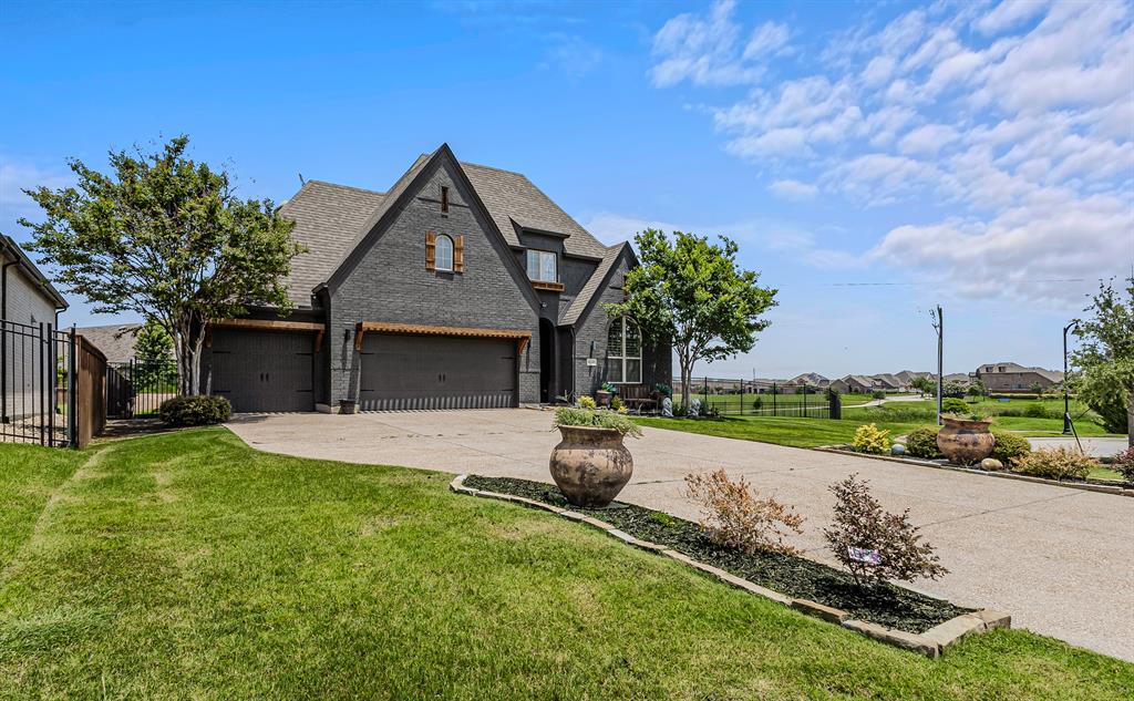 Welcome to the highly sought after subdivision Inspiration!!  Rarely does a home offer this much flexibility, privacy, and outdoor living in one package. Nestled on an oversized cul-de-sac lot backing to a peaceful greenbelt and pond, this exceptional 5-bedroom, 4-bath home delivers the space today's buyers are searching for both inside and out.

Designed with versatility in mind, the floor plan features four bedrooms on the main level, including a secluded primary suite and a private guest or multi-generational living area complete with its own bedroom, bath, and living space. Upstairs offers an additional bedroom, oversized game room, and walk-in attic storage, creating the perfect retreat for guests, teens, or hobbies.

The open-concept design brings everyone together with a spacious living room, dining area, and beautifully appointed kitchen serving as the heart of the home. Plantation shutters and updated luxury vinyl plank flooring add warmth and style throughout the main living areas.

Step outside and discover where this property truly shines. Multiple outdoor living spaces, including a modern covered patio and wraparound porch, provide endless opportunities for entertaining, relaxing, or simply enjoying the scenic views. Whether you're sipping coffee while watching the sunrise, hosting weekend gatherings, or enjoying fireworks from your own backyard, this outdoor retreat is designed to be enjoyed year-round. A separate dog run adds convenience for four-legged family members.

The oversized 3-car garage features epoxy flooring, built-in storage lockers, a utility sink, and direct backyard access.

Located in the award-winning Inspiration community, residents enjoy resort-style amenities including multiple pools, a lazy river, fitness center, fishing ponds, playgrounds, parks, and miles of walking and biking trails. This is more than just a home—it's a place to spread out, unwind, and enjoy the lifestyle you've been looking for.