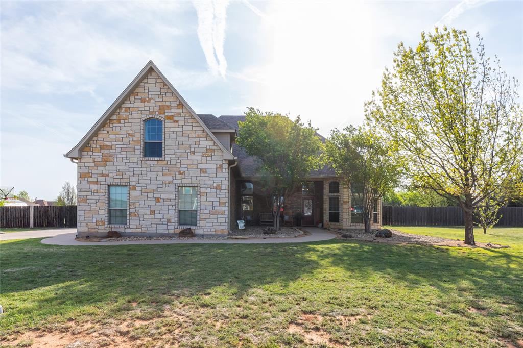Step into this spacious home, thoughtfully designed for comfort, functionality, and entertaining—peacefully located outside the city limits. Featuring 4 generously sized bedrooms, this layout offers both privacy and convenience—including a bedroom with direct access to a bathroom downstairs, perfect for guests or multigenerational living. In addition, a room downstairs offers flexibility to be used as a bedroom or a home office to fit your needs. At the heart of the home, the large kitchen serves as the true centerpiece, featuring an island perfect for casual dining or breakfast gatherings, along with stainless steel appliances, incl. refrigerator. The open-concept design flows seamlessly into the dining room and living room, creating an ideal space for entertaining family and friends. The main living area is warm and inviting, centered around a fireplace that adds charm and comfort. 
Upstairs, you’ll find a 5th bedroom that is a large private space with its own full bathroom and closet—ideal for a guest suite, game room, media room, or anything the buyer envisions. The possibilities are endless!
The large primary suite is a true retreat, complete with its own cozy fireplace, creating the perfect space to unwind at the end of the day. The primary bathroom adds to the luxury with a well-designed layout featuring a large soaking tub, a spacious walk-in shower, and a dedicated makeup vanity area—offering everyday convenience. Step outside to enjoy a large backyard designed for relaxation and entertaining. In addition to the covered patio with a third fireplace, it also features an outdoor kitchen complete with a grill and sink, a garden, chicken coop and tunnel, and a storage shed—perfect for those who love outdoor living, gardening, or hobby farming. This home offers the perfect blend of space and flexibility - ready to fit your needs and create lasting memories.
Brandnew premium impact resistant Class 4 roof just installed! Washer and Dryer will convey.