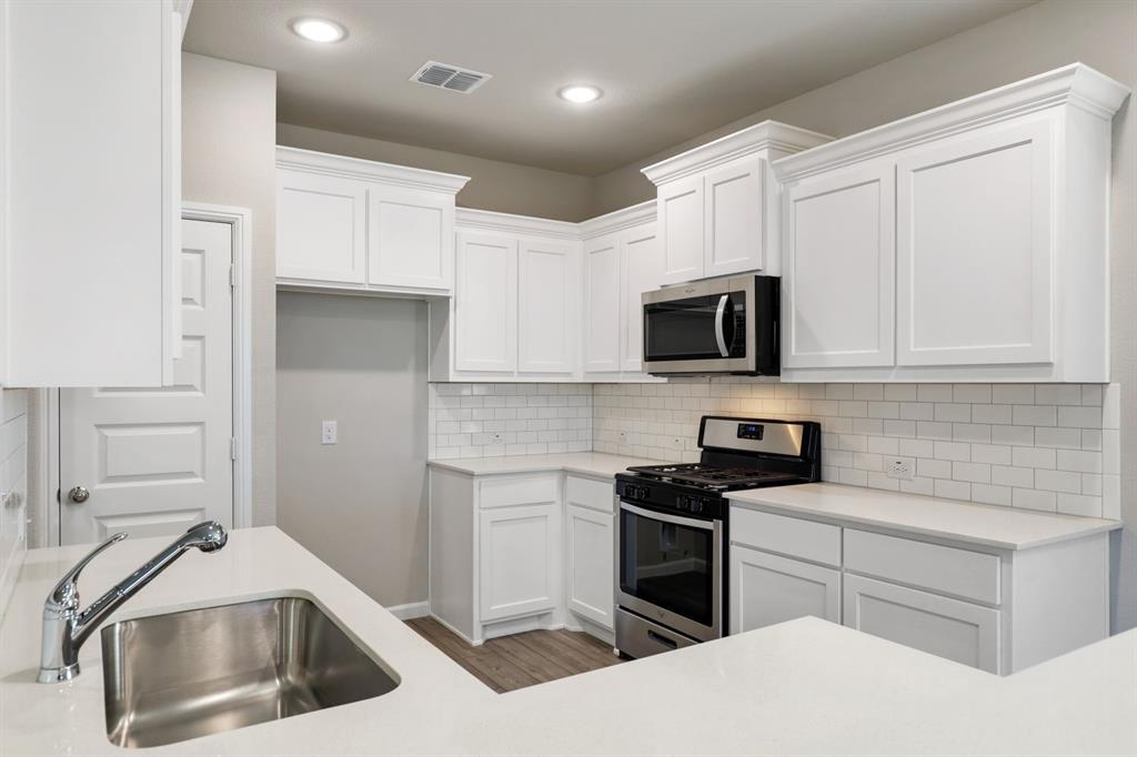 MLS# 20467733 - Built by Trophy Signature Homes - Ready Now! ~ The Sapphire is a gem you are sure to fall for. The exquisite kitchen brings joy to everyday cooking tasks as amateur chefs prop their tablets on the island trying out the latest Food Network recipe. There’s more than enough room to chop veggies for the ratatouille. Hosting guests in the casual dining area? The layout of the island ensures no one will see dirty pots in the sink. Working from home is no problem in your secluded home office. Serenity can also be found in your luxurious primary suite. The downstairs location means peace and quiet even if the kids are having a sleepover upstairs. A convenient utility room, formal dining room and covered patio are splendid accompaniments to the design!!!