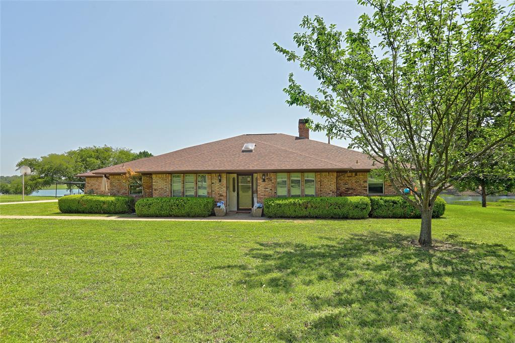 Incredible opportunity for country living w in mins of everything.Conveniently located just off 380 & Custer,this 2-acre property in the desirable Walnut Grove of McKinney ISD w no HOA.This beautiful 1-story home offers 3 bedrooms,2.5 bathrooms & 2,872 sq.ft. of open living space situated on a private lake.Take in the beautiful views that surround the home.Gather around the brick fireplace or add a little entertainment w the wet bar & pool table in the gameroom.The kitchen has a smooth top stove,trash compactor,dishwasher,refrigerator,microwave,oven,pantry,granite countertop & backsplash.Primary suite has a dual sink vanity,garden bathtub,separate shower & walk in closet.This home features paneling,raised ceiling,ceiling fans,beamed ceiling,built ins,plantation shutters & sky lights throughout.The backyard has a nice sized patio,luscious landscaping & trees.The diving pool is perfect for relaxing and enjoying the scenery.There is extra storage in the shed & the golf cart stays as well.