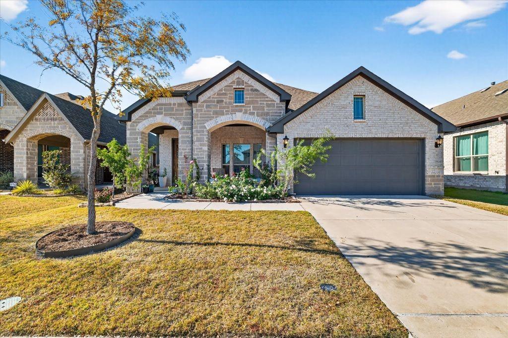 2023 built one story Bloomfield home in Willow Wood with 3 bedrooms, 2 bathrooms, and front office with French doors. Open kitchen, dining, and living layout with multiple rear facing windows providing natural light across main living areas. Engineered wood flooring in entry, office, kitchen, dining, and living areas. Kitchen includes island, cabinetry upgrades, pantry, and dining area open to living space. Primary bedroom includes sitting area, larger windows, and ensuite bath with separate vanities, tub, and shower. Secondary bedrooms are positioned separately from primary suite. Backyard includes brick rear wall, lawn area, patio space, and established magnolia, live oak, and Chinese pistache trees. Community amenities include pool, parks, trails, and common areas.